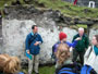 Marc Conner with students inside the home of Br�d Keane in the village, Great Blasket Island