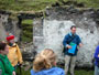 Marc Conner with students inside the home of Br�d Keane in the village, Great Blasket Island